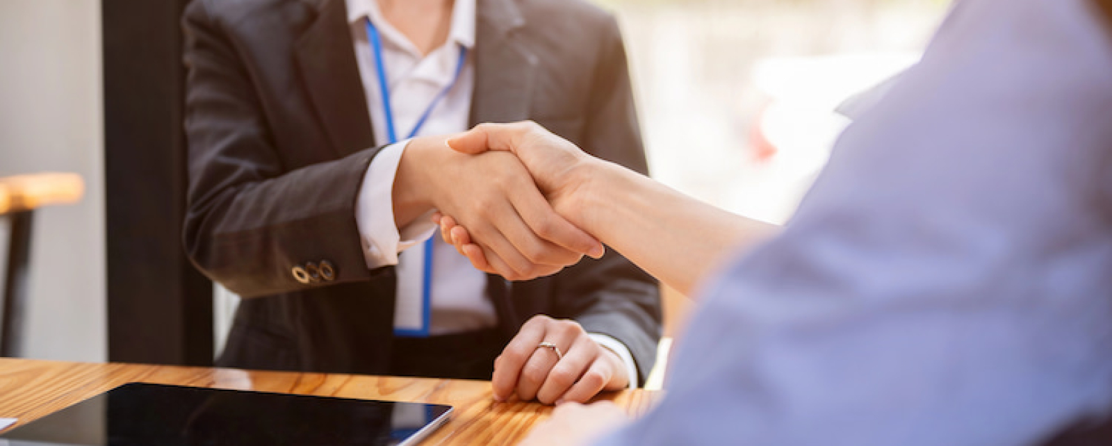 A handshake ensuring that a deal with a customer is properly done and is thorough.
