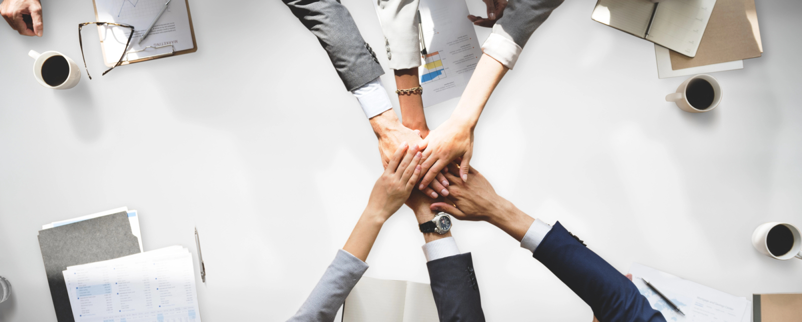 Employees hands together 